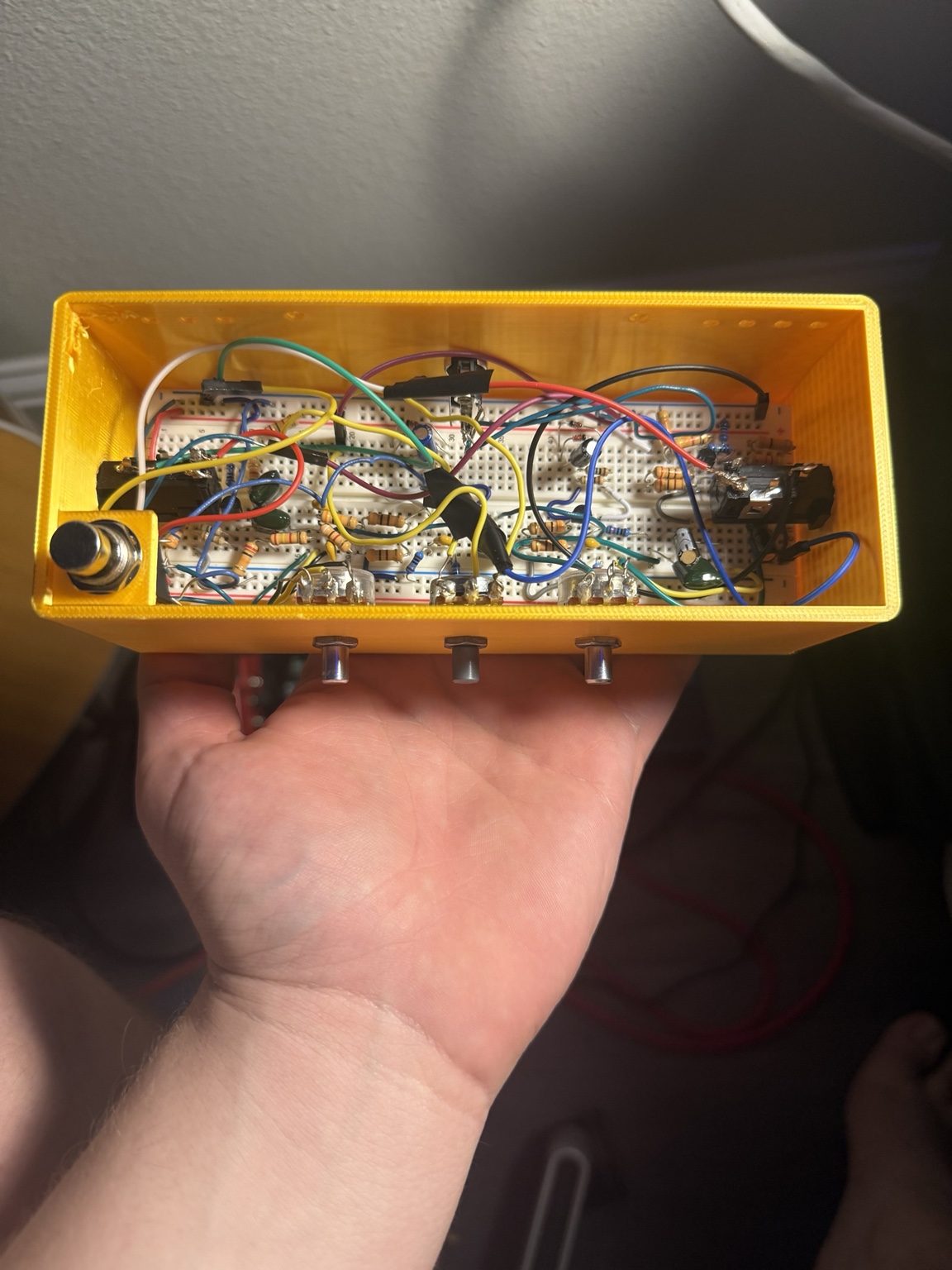 Big Muff Pi clone circuit assembled in a yellow enclosure
