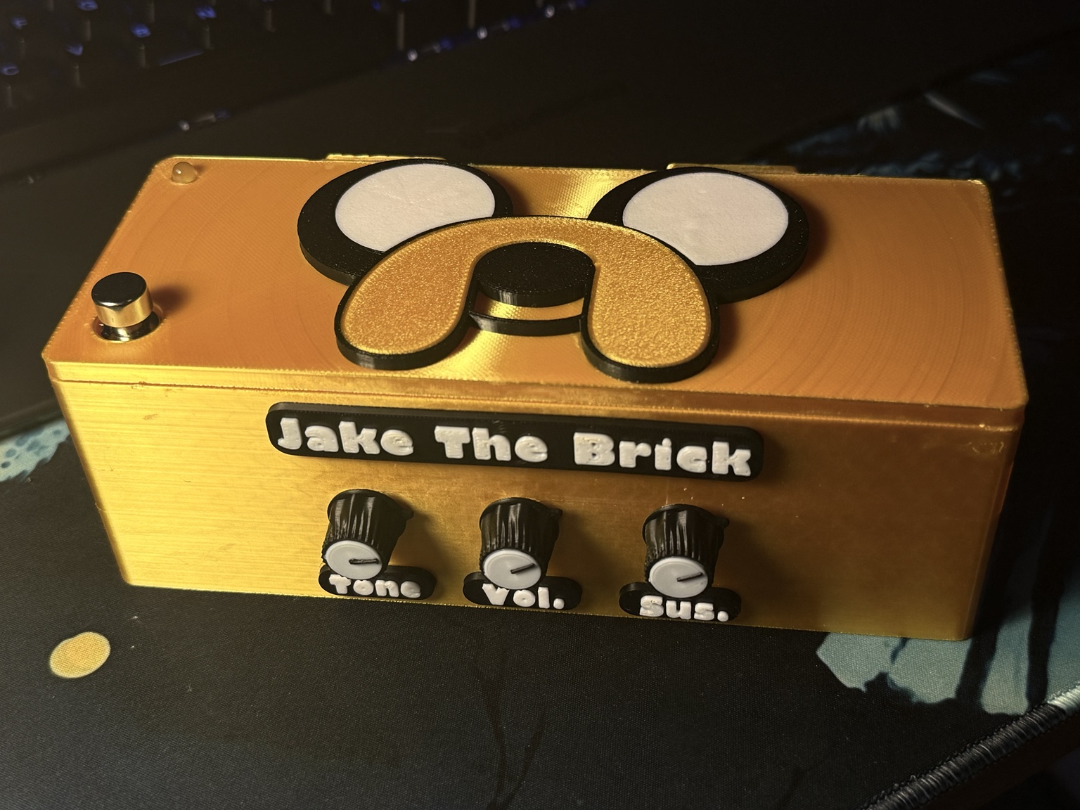 Gold 3D-printed Big Muff Pi guitar fuzz pedal enclosure with custom controls