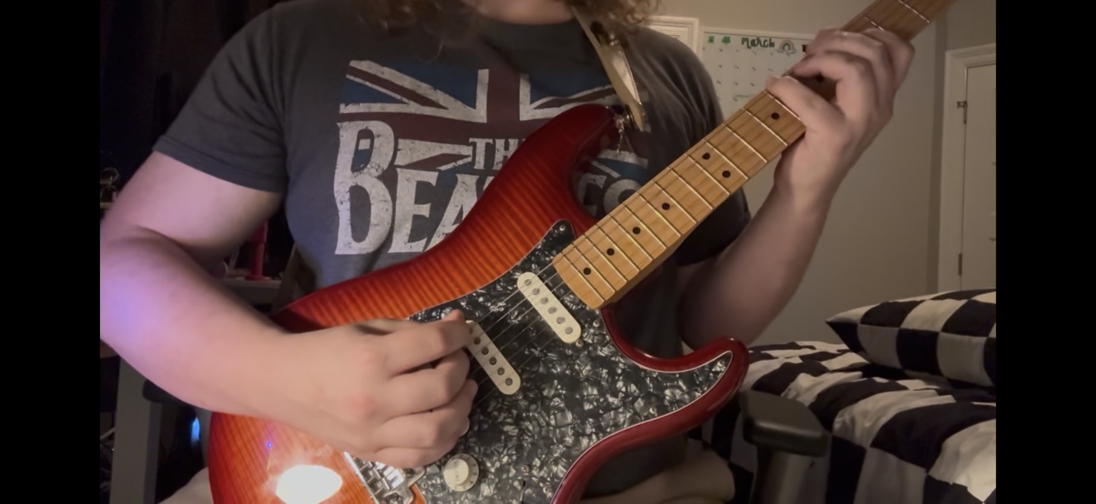 Playing electric guitar