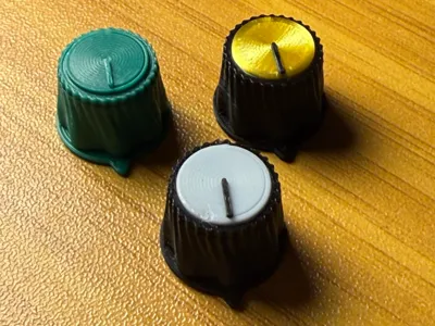 Three custom 3D-printed control knobs