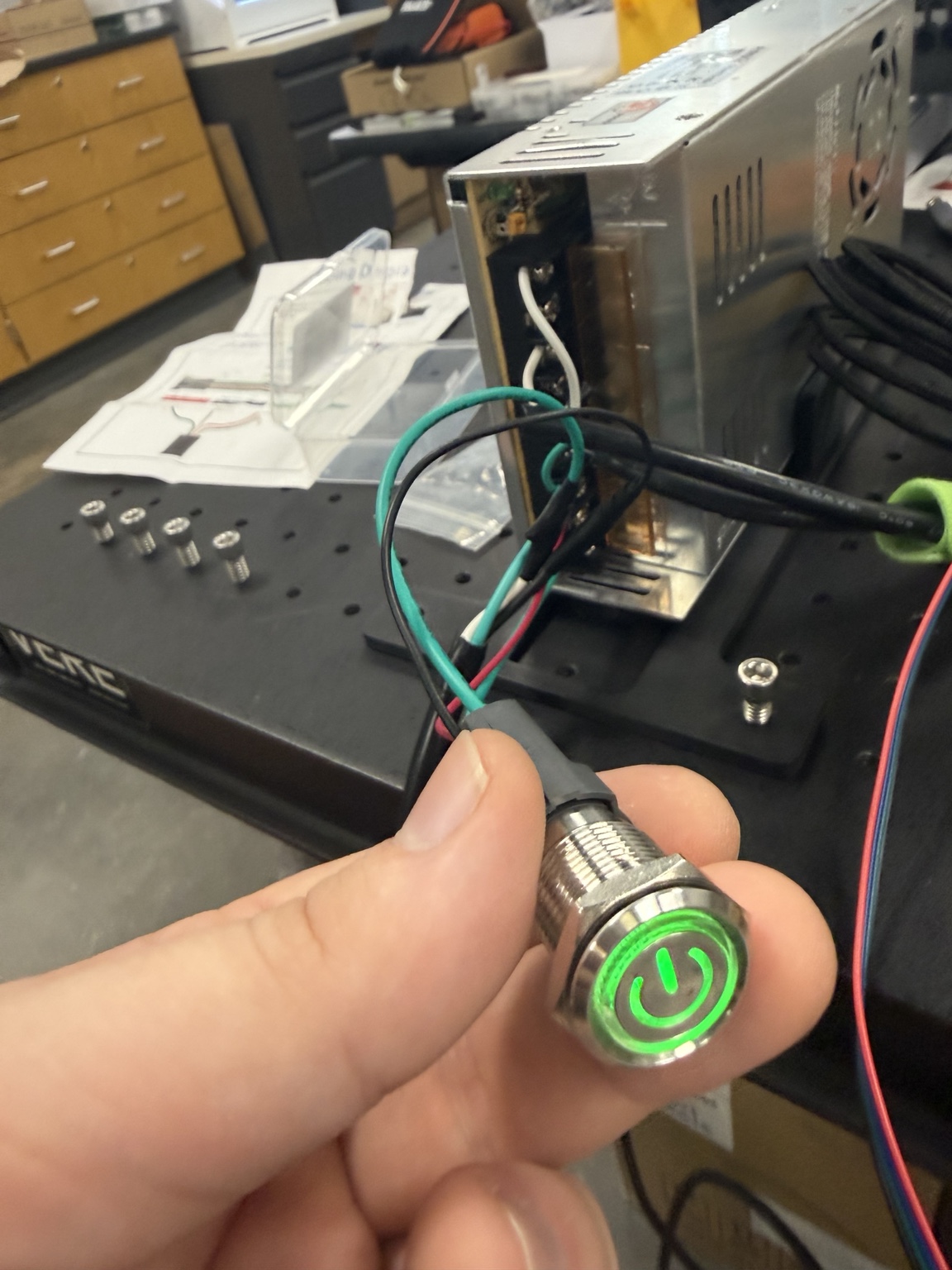 Wired illuminated power button being integrated into the robotic additive manufacturing system