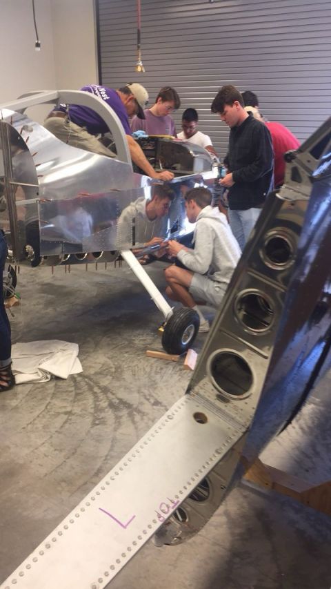 Student team assembling the RV-12 aircraft in a workshop