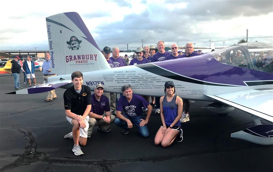 Student builders and mentors with the completed RV-12 aircraft